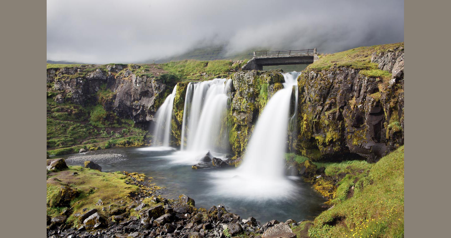 Beautiful waterfall below an old sheep bridge